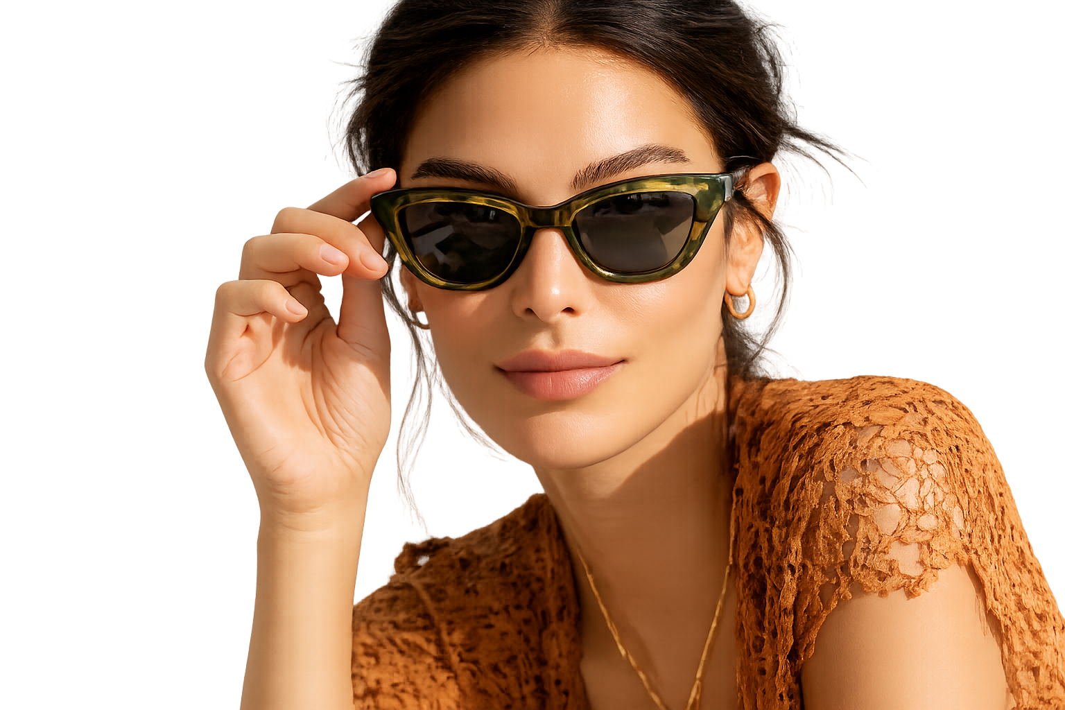 Model wearing deep-green tortoise cat-eye sunglasses in warm natural light
